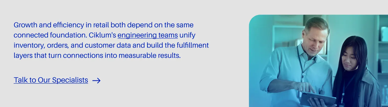 A website banner featuring text on the left that reads: "Growth and efficiency in retail both depend on the same connected foundation. Ciklum's engineering teams unify inventory, orders, and customer data and build the fulfillment layers that turn connections into measurable results," with a link below reading "Talk to Our Specialists". On the right is an image of two colleagues looking at a tablet together.